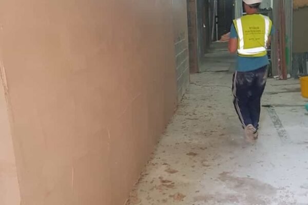 Man working in full health and safety work wear