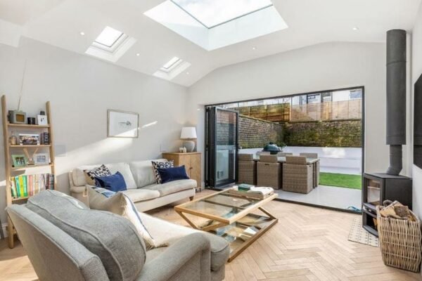 Modern living room with large doors leading to garden