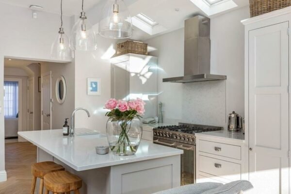 Modern clean interior of a white and grey kitchen