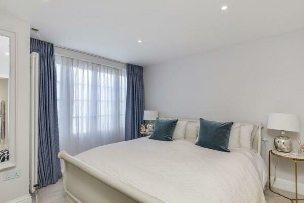 Clean white interior of a bedroom