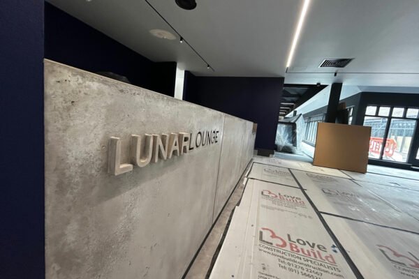 Interior of a modern room with sign named "Lunar Lounge"