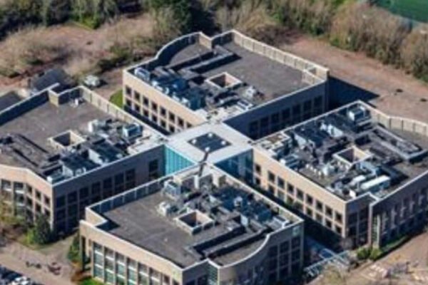 Drone of 4 large buildings connected in the middle